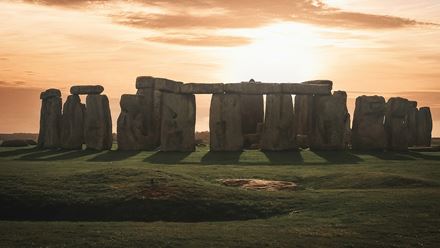 Enjoy the sun rise over the stones at Stonehenge. Image courtesy of  Unsplash, credits: K Mitch Hodge