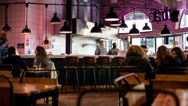 People sit in a restaurant in camden.
