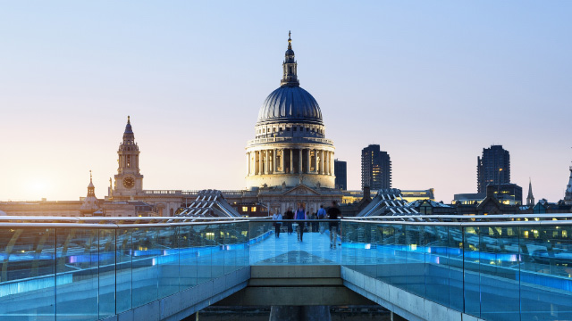 Views of St. Paul's Cathedral and the City of London from Millennium Bridge in the evening