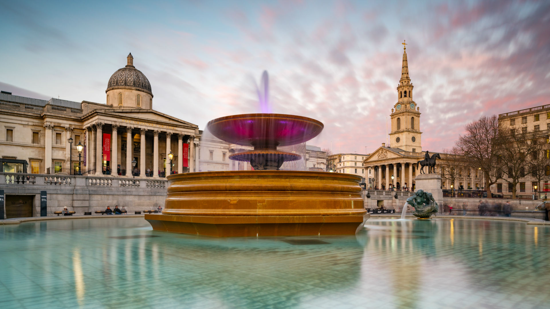 Trafalgar Square and the National Gallery in the background, with the fountains lit up in the foreground © visitlondon.com/Jon Reid Trafalgar Square and the National Gallery in the background, with the fountains lit up in the foreground © visitlondon.com/Jon Reid