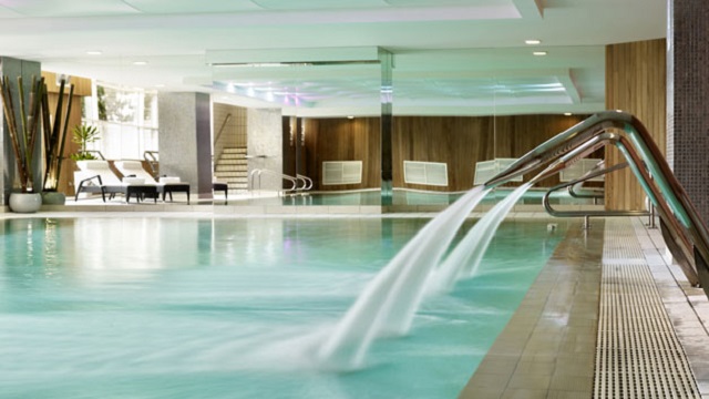 Head to The Chelsea Harbour Hotel & Spa sauna before taking a dip in the pool. Credit: Red Letter Days. Image courtesy of Red Letter Days. Landscape shot of a big indoor spa pool, with water jets along the side of the pool and sunbed loungers around the outside