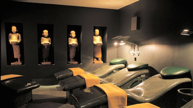 Heated stone beds with towels on in the relaxation room