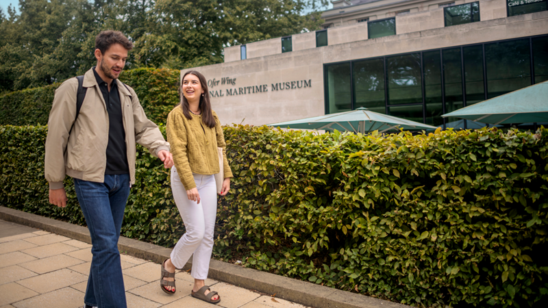 A man and woman walking together on the National Maritime Museum tour