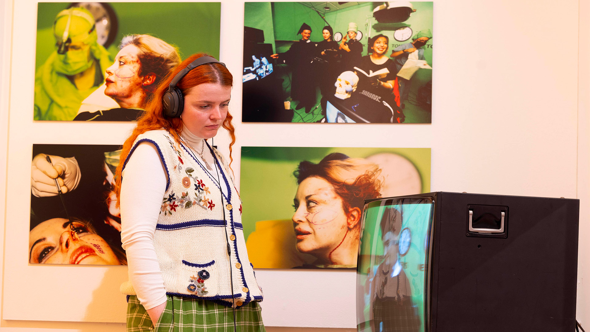 ORLAN, Omniprésence (1992) at Virtual Beauty, Somerset House. Image courtesy of David Parry/PA Media Assignments. A woman engages with an artwork at Somerset House