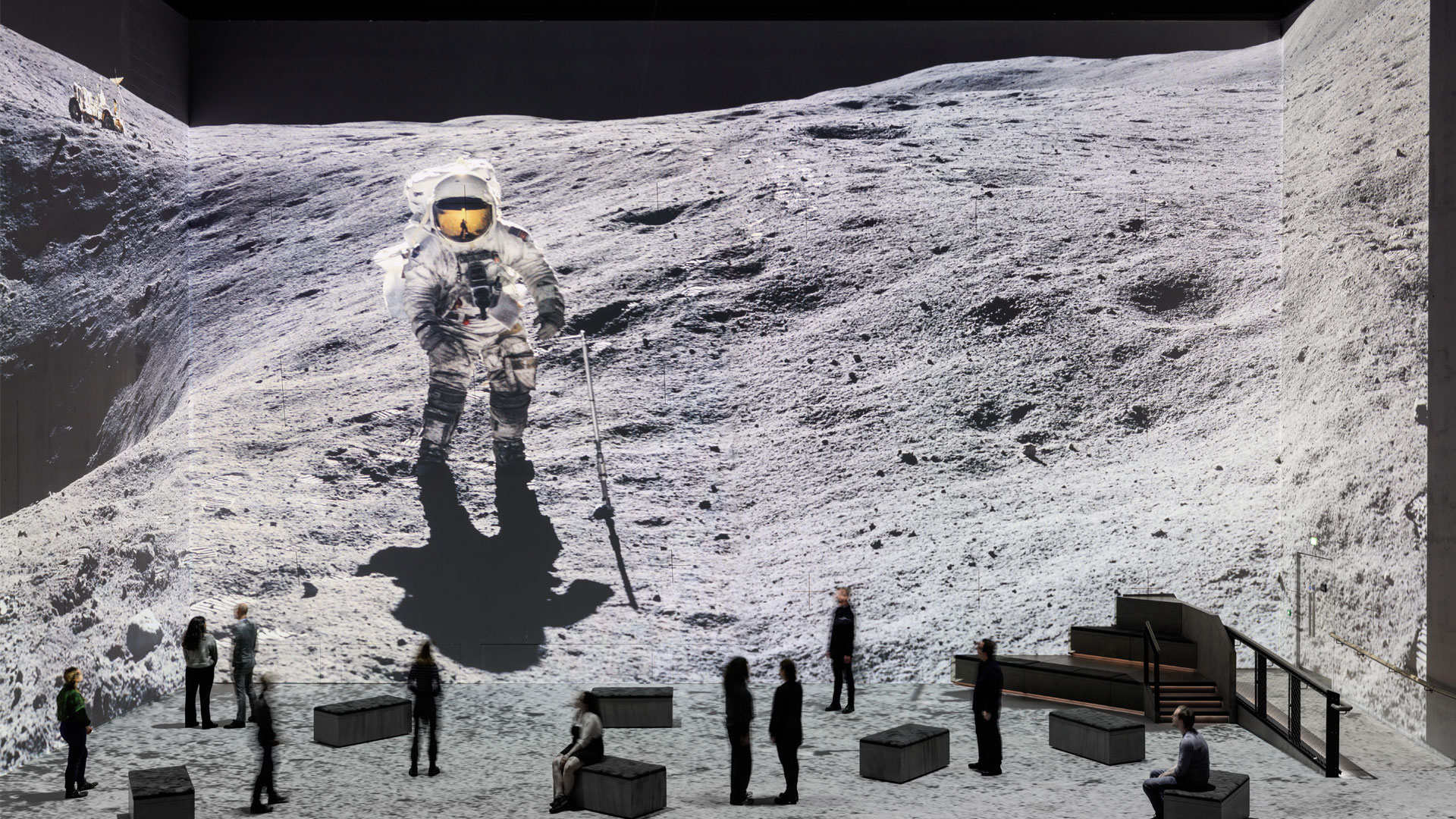 Experience a unique perspective of space exploration at The Moonwalkers: A Journey with Tom Hanks at Lightroom. Image courtesy of Lightroom/ Justin Sutcliffe. Large-scale projection of astronaut walking on the moon at Lightroom.
