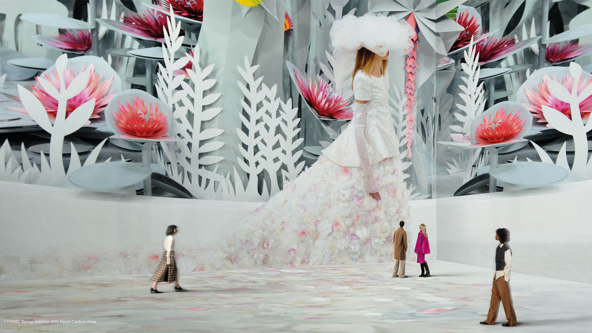 CHANEL Spring-Summer 2015 Haute Couture show at Vogue: Inventing the Runway at Lightroom. Image courtesy of Lightroom. Chanel catwalk from Vogue's archives on walls at Lightroom.