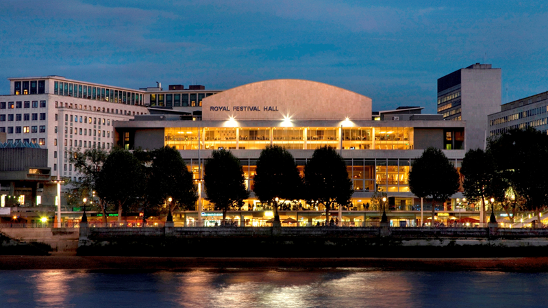 Choose from one of many musical events at Royal Festival Hall inside the Southbank Centre. Credit: Morley von Sternberg. Image courtesy of Southbank Centre. A view of Royal Festival Hall on the south bank of the Thames from the other side of the river