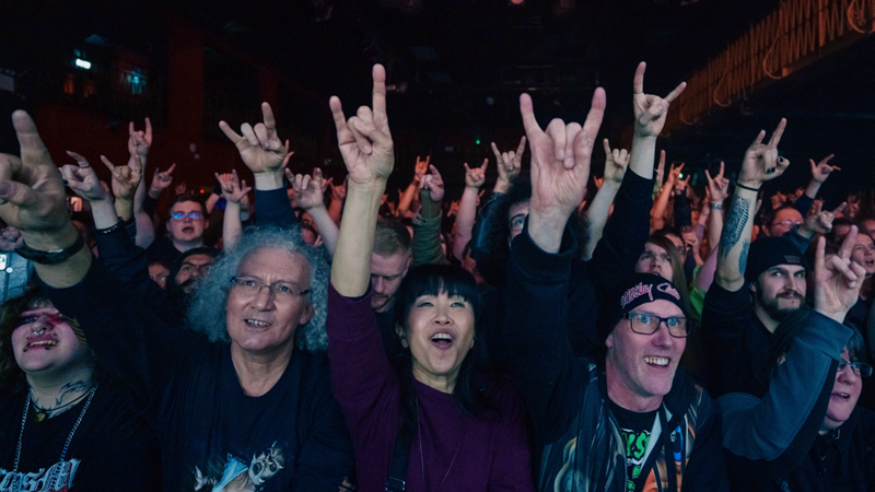 Rock out in the mosh pit at Electric Ballroom in Camden. Credit: Shutterstock. Image courtesy of Shutterstock. Fans throw up rock signs in the crowd at Electric Ballroom