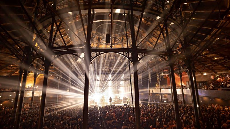 Enjoy a showstopping schedule of events at Roundhouse in Camden. Credit: Lloyd Winters. Image courtesy of Roundhouse. Bright lights shine through the architecture of Roundhouse as band play to a full crowd