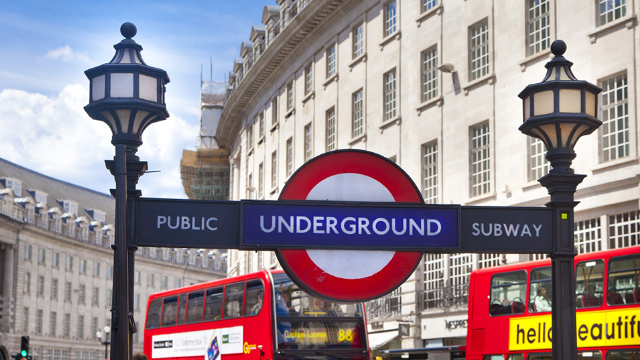 Sign at the entrance of a London Tube station on a sunny day