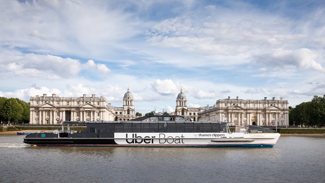 Enjoy an optional boat ride along the Thames. Image courtesy of Uber Boat by Thames Clippers. The Uber Boat by Thames Clippers river bus floats along the river Thames past the Old Royal Naval College.