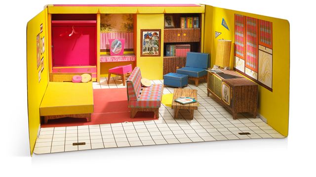 Model of the Barbie Dream House with pink and yellow furnishings. 