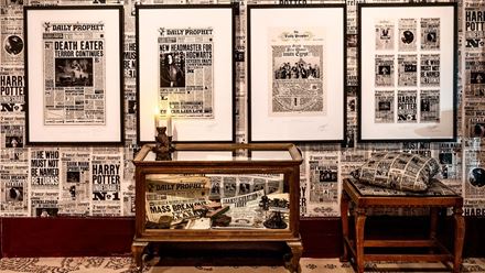 Explore walls covered in prints and graphics. Image courtesy of the House of MinaLima.