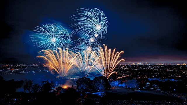 Golden and electric blue firework illuminate the London sky on Guy Fawkes night. 