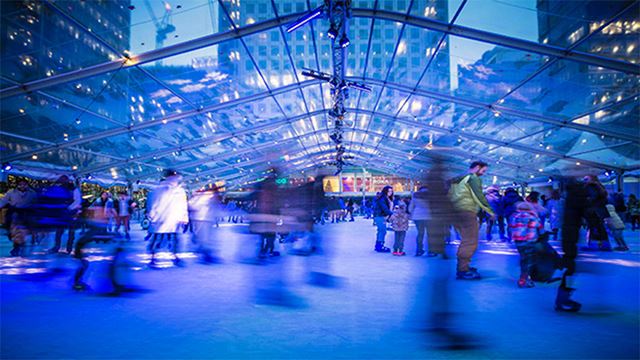 Skaters glide beneath staggering skyscrapers at Ice Rink Canary Wharf 