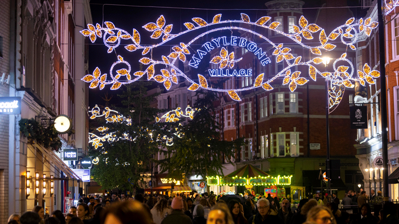 Spot the golden leaves adornng the street at Marylebone Christmas lights. Credit: Dave Parry/PA Wire. Image courtesy of Sister London. Marylebone Christmas lights hover above the bustling streets