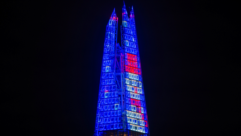 Watch colourful installations illuminate the top 20-storeys of London's tallest skyscraper for Shard Lights. Credit: The Shard. Image courtesy of The Shard. The Shard Snowman lights up the Shard for Christmas