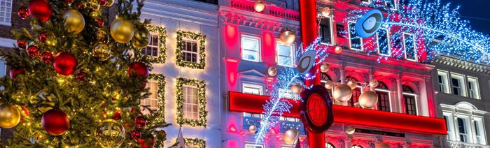 Bright Christmas window displays in Mayfair London.