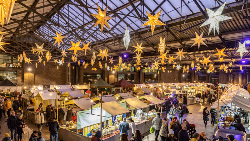 King's Cross Christmas Market. Credit: John Sturrock. Image courtesy of John Sturrock/King's Cross. Star shaped lights hang above King's Cross Christmas market