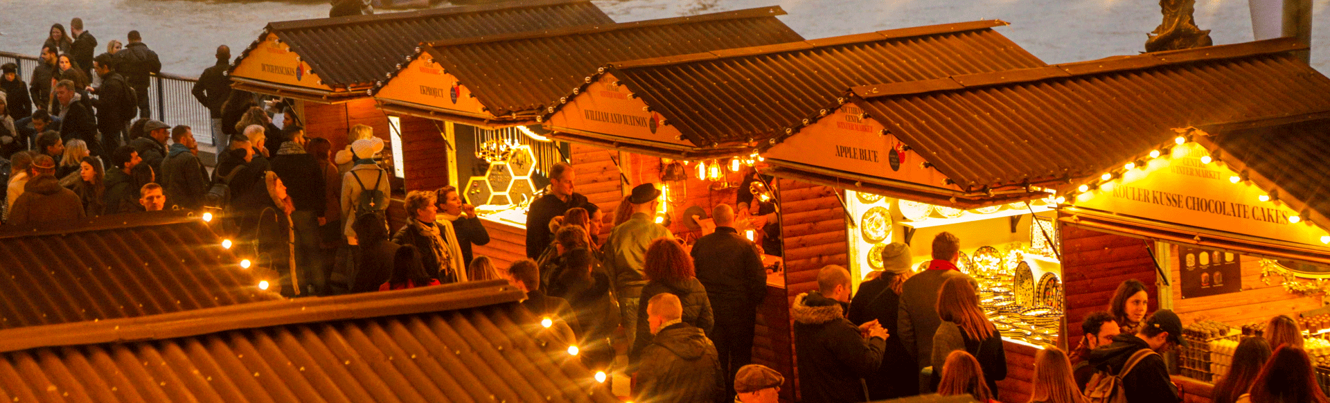 Christmas chalets by the river Thames at Southbank Centre Winter Market