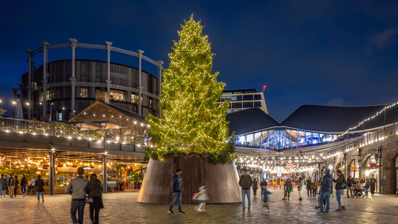 Get in the festive spirit with the help of the Christmas lights adoring Coal Drops Yard in King's Cross. Credit: John Sturrock. Image courtesy of King's Cross. Coal Drops Yard Christmas tree 2023