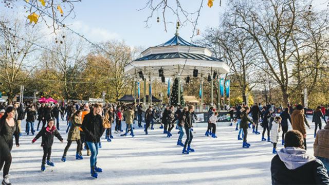 Skaters at Hyde Park Winter Wonderland Ice Rink on a sunny winter's day