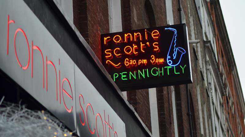 Find world-class acts play at the legendary Ronnie Scott's jazz club. Credit: Ronnie Scott's. Image courtesy of Ronnie Scott's. Neon sign to Ronnie Scott's jazz club which says