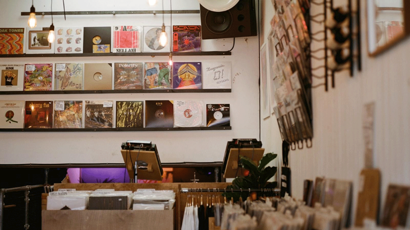 Hunt for hidden gems at Next Door Records in east and west London. Credit: Seb Gardner. Image courtesy of Next Door Records. Records are dotted around the whole venue with DJ decks and speakers