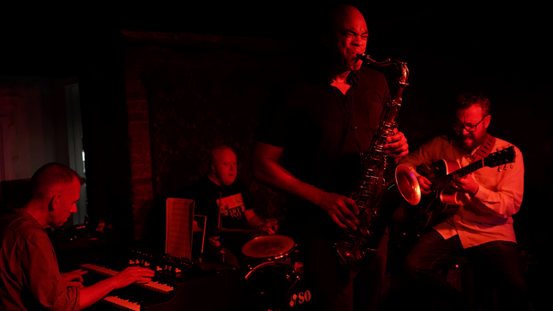 Treat yourself to an unmissable live jazz show at The Troubadour. Credit: The Troubadour. A jazz band plays live music under red lights at The Troubadour