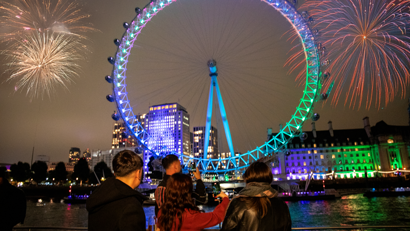Take in the showstopping NYE fireworks display from a City Cruises boat. Credit: City Cruises. Image courtesy of City Cruises. A group of friends watching the fireworks from a City Cruises boat as the London Eye lights up in purple and green next to the river Thames