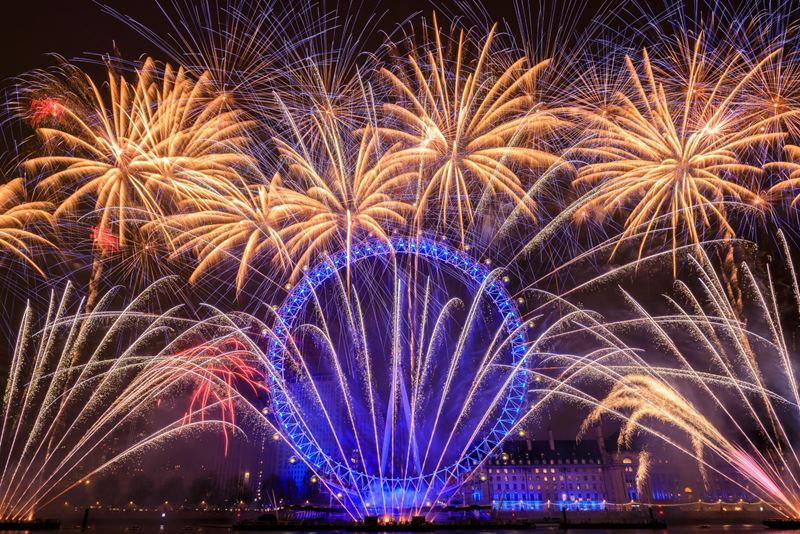 Celebrate New Year's Eve in London with the iconic annual fireworks display Credit: Shutterstock. Image courtesy of Shutterstock. Colourful New Year's Eve fireworks above the London Eye which is lit up with blue lights
