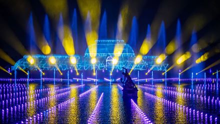 Palm House dazzles in bright blue and yellow lights at Christmas at Kew 2023. © RBG Kew