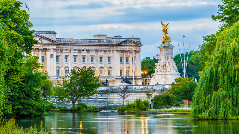 For 10 weeks only each summer, tourists can see the interior of Buckingham Palace. Credit: Shutterstock. Image courtesy of Shutterstock. Buckingham Palace behind a lake on a cloudy day in London.