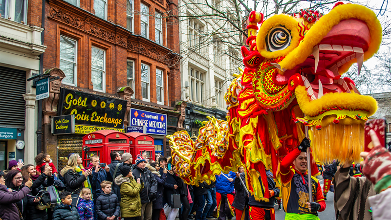 See the joy and celebrations of Chinese New Year in the streets of London. Credit: Shutterstock. Image courtesy of Shutterstock. A dragon figure is paraded through the streets for Chinese New Year in London