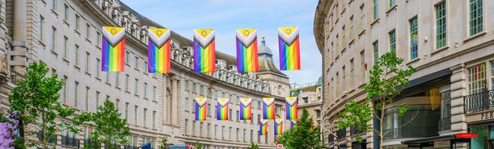 Regent Street displaying the colourful flags of Pride on a sunny day