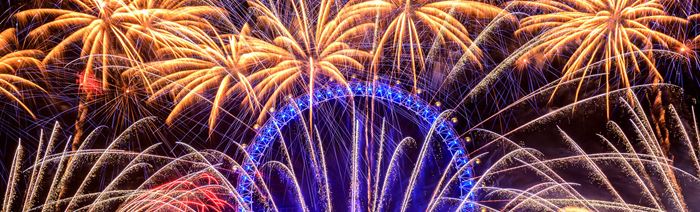 Golden fireworks light up the sky over the London Eye. 