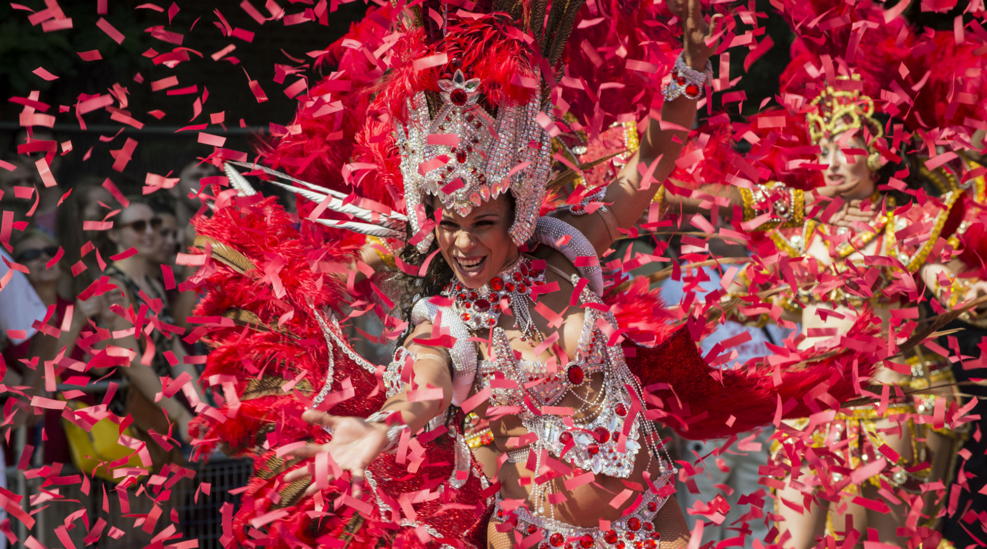 A carnival queen dancing at the Notting Hill Carnival © Natasha108 via iStock. Image courtesy of Natasha108 via iStock. A Notting Hill Carnival performer dances while surrounded by confetti