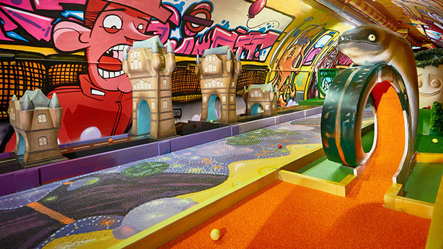 Test your skills on the colourful London-inspired golfstacles at Plonk! Golf. Credit: Tom Lewis Russell. Image courtesy of Plonk Golf. A hyper-coloured crazy golf course with graffiti and London-inspired obstacles