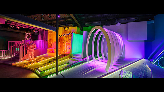 Step into a pop video-themed crazy golf experience at Pop Golf © Andrew Meredith. Image courtesy of Pop Golf. A neon lit, multi-coloured row of golf obstacles at Pop Golf