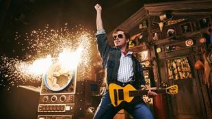 Vasco Emauzas takes on the role of Marty McFly in Back to the Future, playing electric guitar as amps explode with sparks.