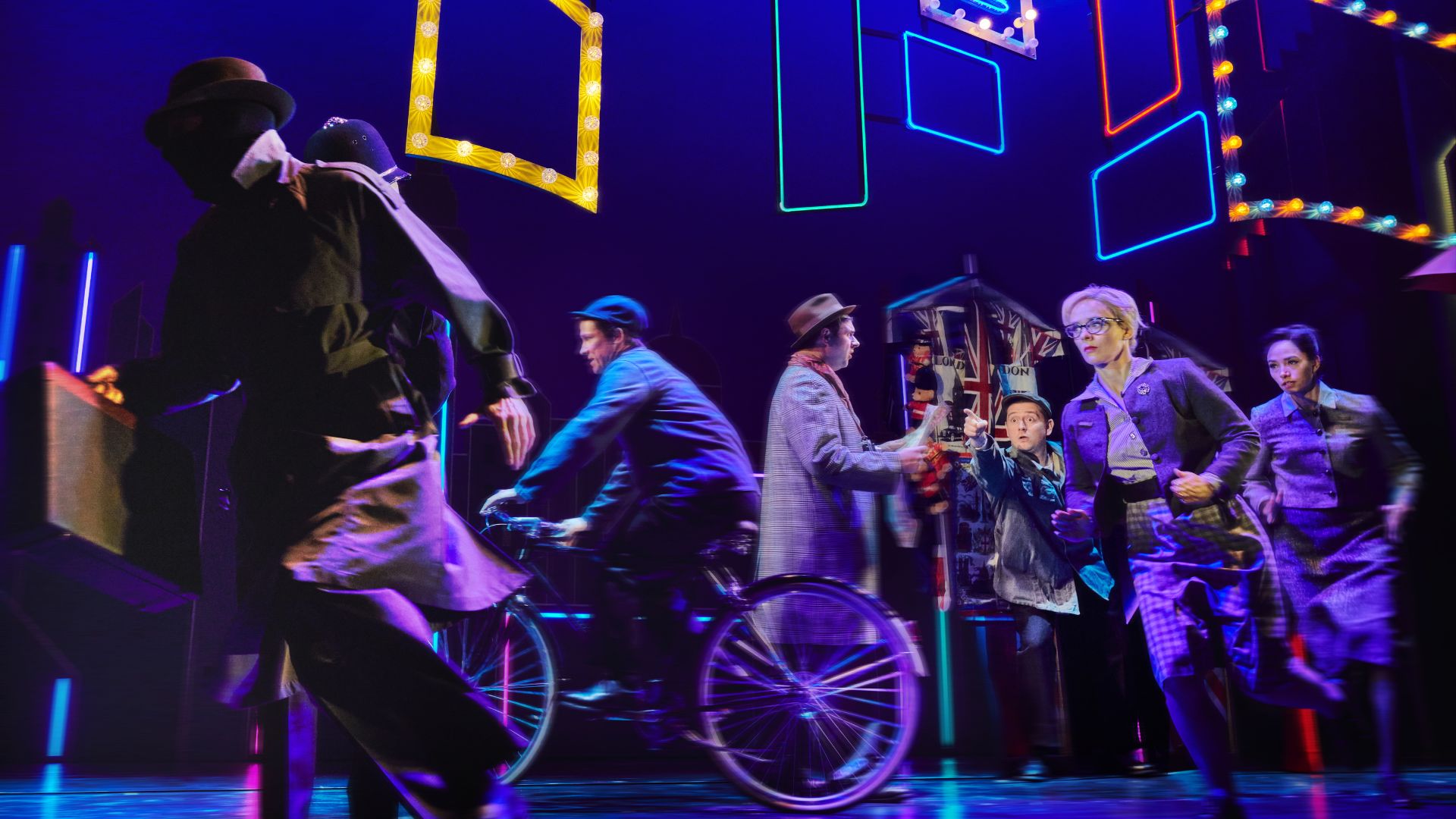 Brilliant sets bring a high-stakes pursuit on the streets of London to the stage at The Comedy About Spies. Image courtesy of London Theatre Direct. A high speed chase through the streets of London