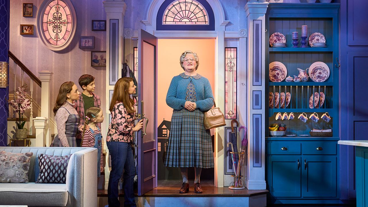 Follow the tale of Mrs Doubtfire based on the aclaimed film starring the late Robin Williams. Image courtesy of See Tickets. Mrs doubtfire stands in the doorway of the home of her family next to her three children and ex wife.
