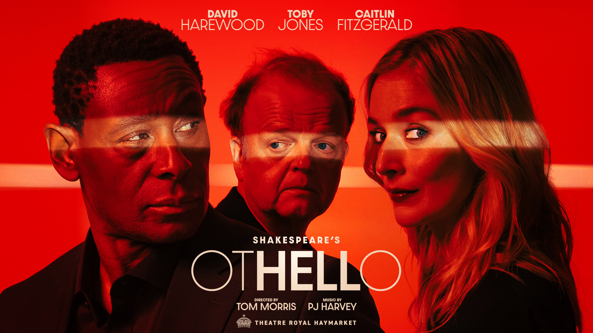 Secure tickets to the eagerly anticipated new production of Shakespeare's Othello at Theatre Royal Haymarket. Image courtesy of London Theatre DIrect. The three actors in the new London stage adaptation of Othello are looking sideways while bathed in red light.