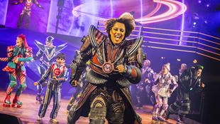Jade Mavin, who plays the role of Momma in Starlight Express, is at the centre of the action with other members of the cast dancing on stage.