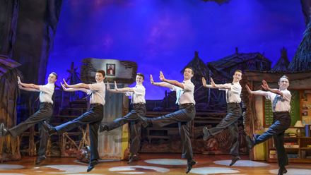 The book of Mormon cast on the London West End Stage at the Prince of Wales Theatre. Image courtesy of Dewynters.