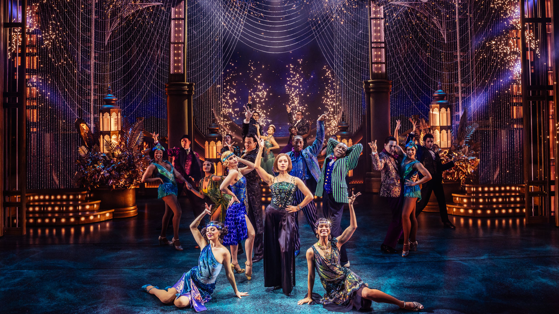 See the stage adaptation of one of F Scott Fitzgerald's greatest novels and immerse yourself in the Golden Age of Jazz with The Great Gatsby musical at the London Coliseum. Image courtesy of SEE Tickets. The cast of The Great Gatsby stand on the stage and pose for the audience while wearing outfits in the style of the 1920s in a variety of colours.