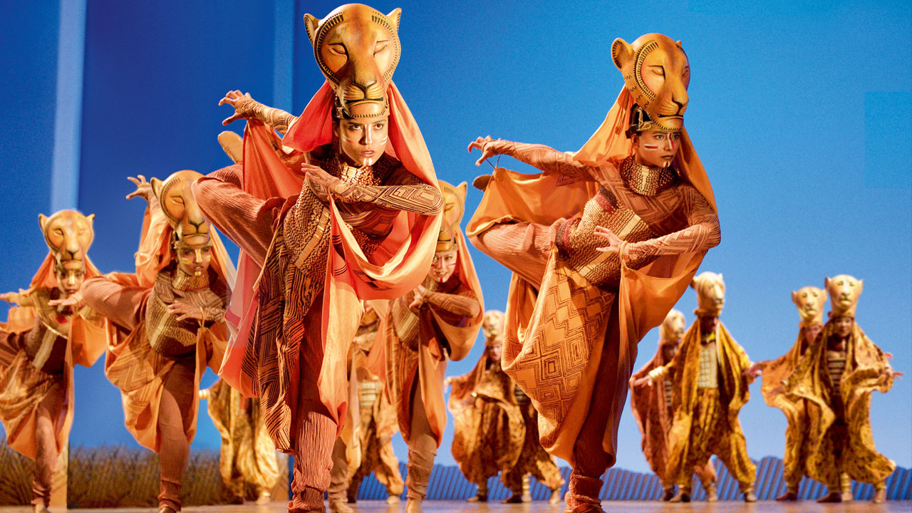 The Lion King musical © Deen van Meer / See Tickets. Dancers performing the lioness hunt on stage at the Lion King musical
