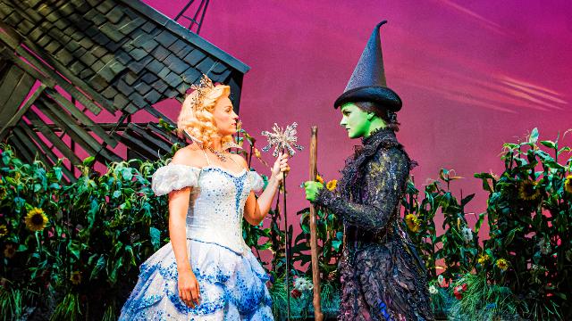 Helen Woolf (Glinda) and Nikki Bentley (Elphaba) in Wicked at Apollo Victoria Theatre. Image courtesy of Jo Allan PR. Photo credits: Matt Crockett. The good witch glenda and wicked with elphaba from london musical Wicked at the Apollo Victoria Theatre.