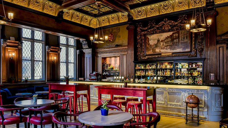 Delight in a menu of traditional pub classics at Lady Abercorn's Pub & Kitchen. Credit: Andaz Liverpool Street. Image courtesy of Andaz Liverpool Street. The eccentric pub surroundings with chandeliers, wooden tables and modern bar stools mix old and new