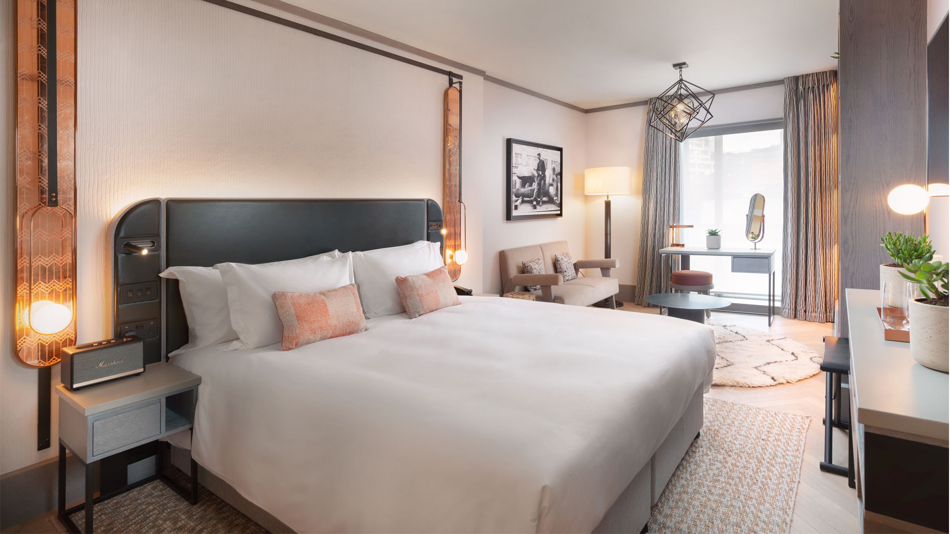 Enjoy a chic retreat at Hart Shoreditch Hotel London, Curio Collection by Hilton. Image courtesy of Hilton. Bedroom as part of a suite at Hart Shoreditch Hotel London.